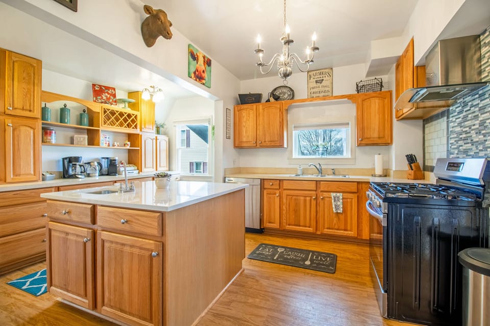 Full kitchen with gas stove top, oven, dishwasher, refrigerator, coffee maker, and more!