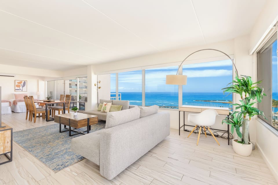 Lving room that boasts an unobstructed view of the ocean.