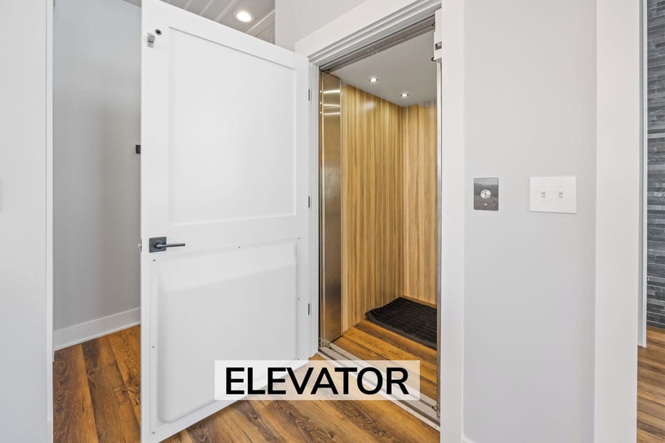 Surf or Sound Realty - 1204 - Ocean's 12 - Elevator - Label