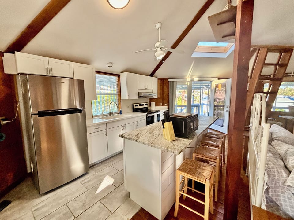 Updated fully equipped kitchen with new large sitting island.
