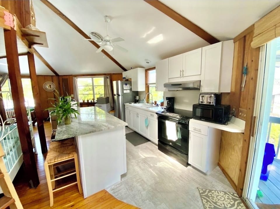 Updated fully equipped kitchen with new large sitting island.