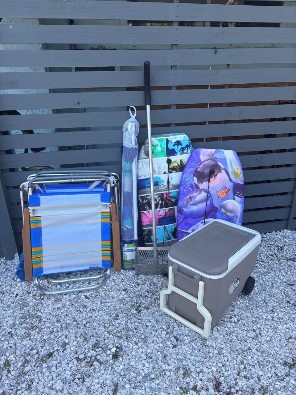 Beach chairs, cooler, umbrella, boogie boards, shark tooth shifter provided