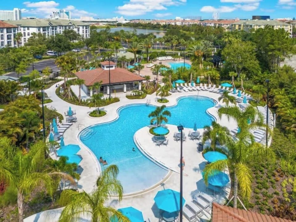 Dive into relaxation at this resort-style pool with lush surroundings and ample seating. Perfect for unwinding after theme park adventures, it's your tropical oasis just minutes from Orlando’s top attractions. Book your getaway today!
