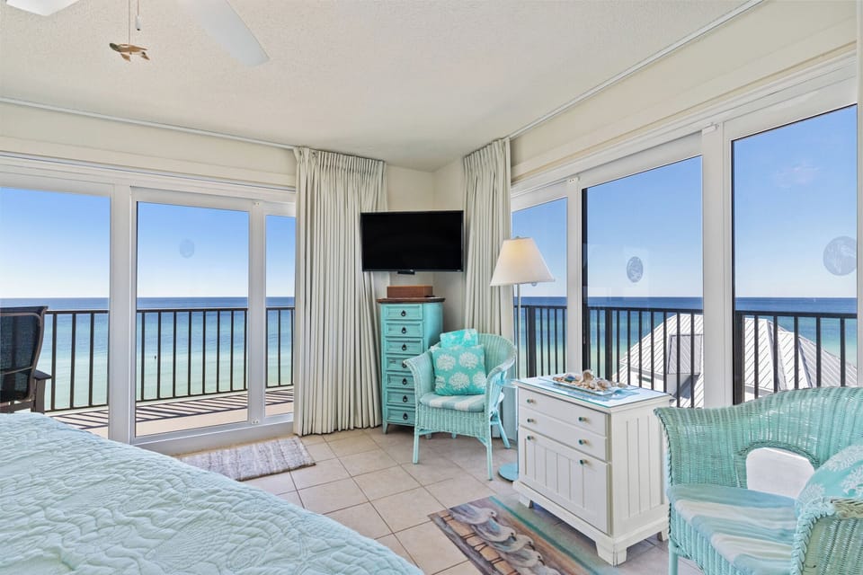 Master Bedroom with King Bed, Ensuite Full Bathroom, and Direct Balcony Access with Beachfront View.