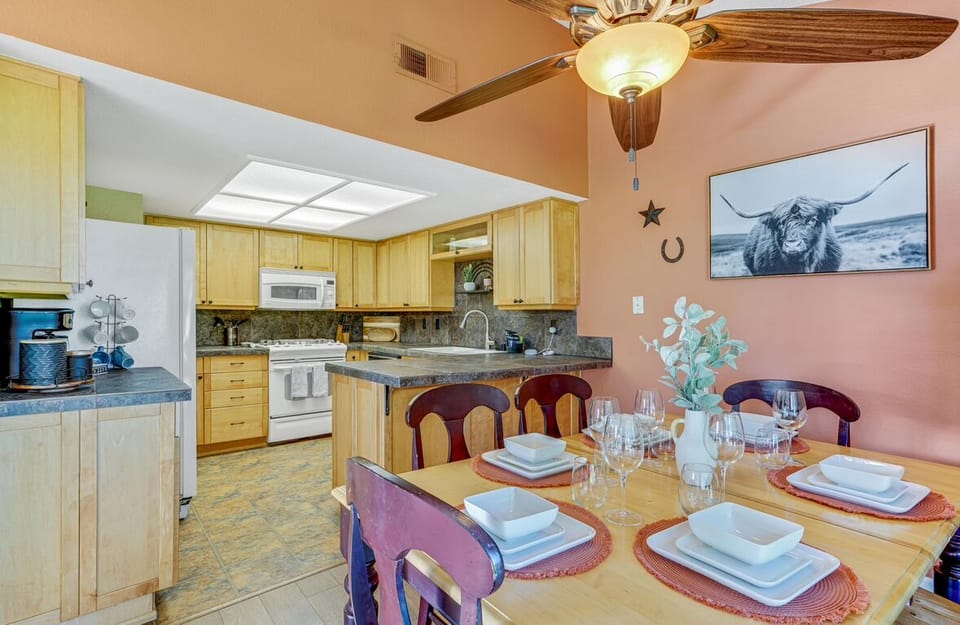 Kitchen and dinning room area that can accommodate six people to share a meal.