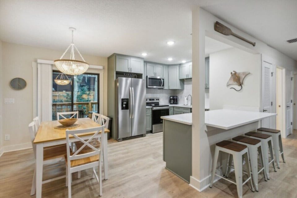 Kitchen and dining area with sliders leading to rear deck