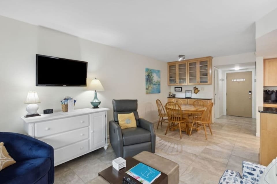 Unwind in the living area with streaming TV, dining space, and balcony access.