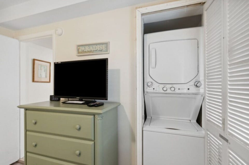 Convenient in-unit washer and dryer located in the guest bedroom closet.