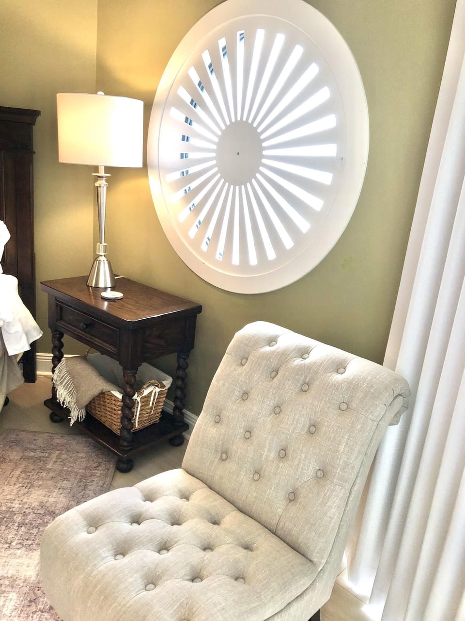 The master bedroom has curtains and a custom shutter for keeping out the morning light!