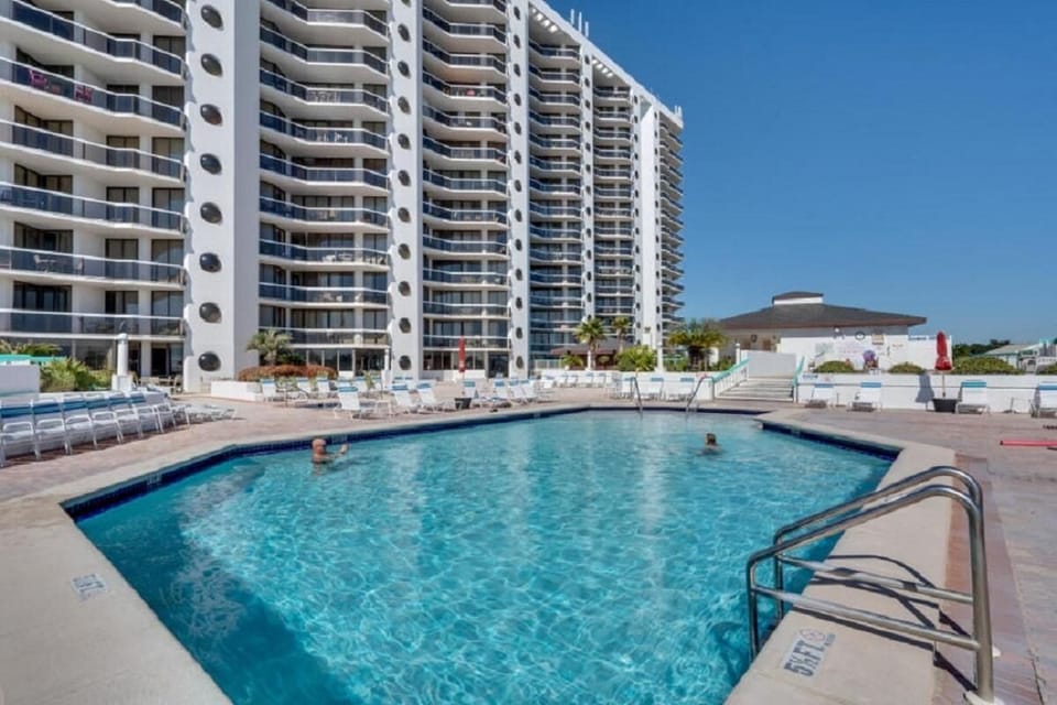 The pool deck has plenty of space to relax and enjoy the pool and hot tubs!