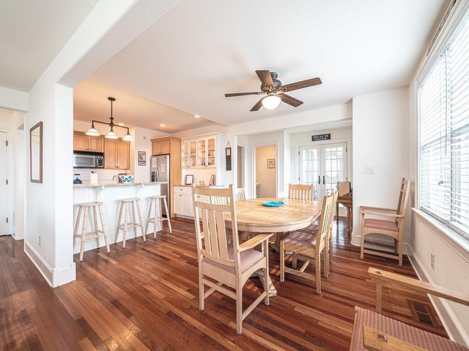 Full kitchen with modern appliances and bar seating, making meal prep and casual dining a breeze.