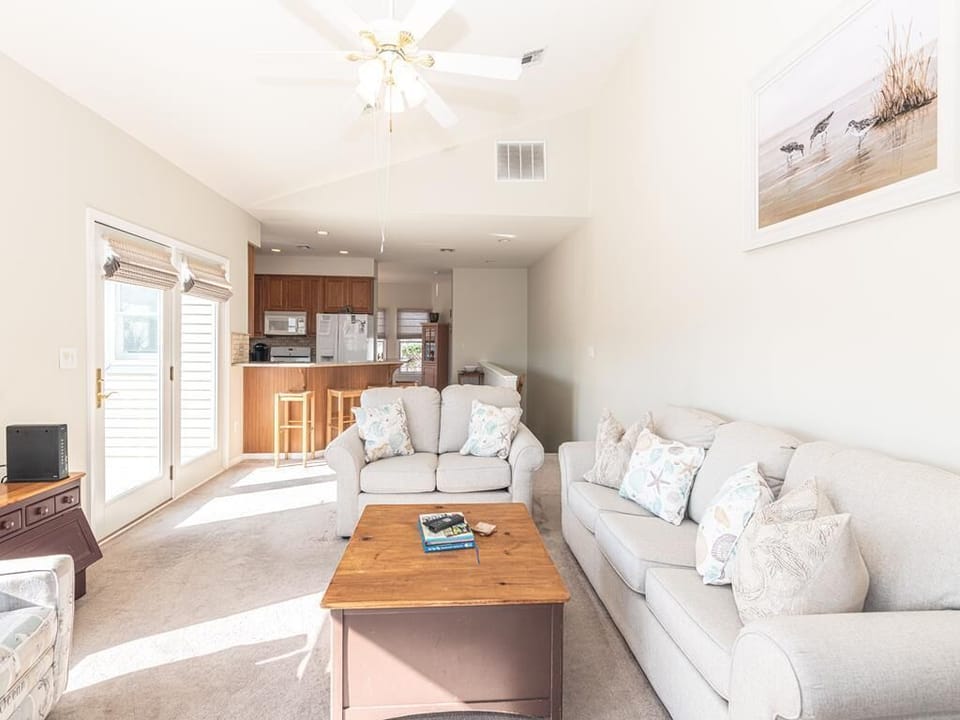 Another view of the living space showcasing its inviting layout and direct access to the deck.