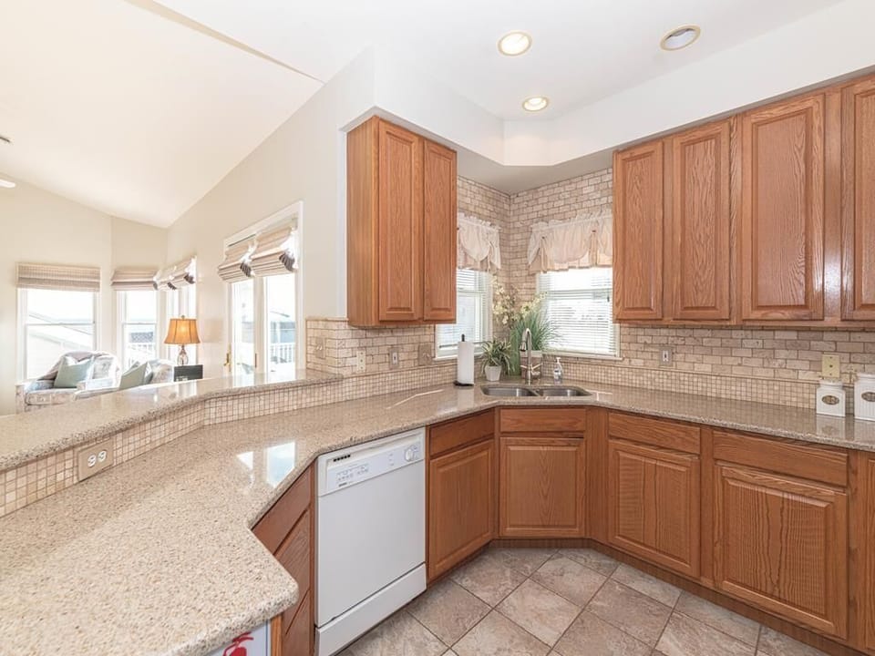 A closer look at the spacious kitchen, featuring modern appliances and a thoughtful layout.
