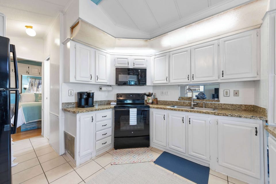 Cook in the full kitchen with granite counters