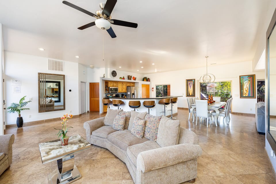 Open-concept design and large windows invite the natural light and stunning Thunder Mountain views inside, while soft throws and plush rugs add an extra layer of comfort.