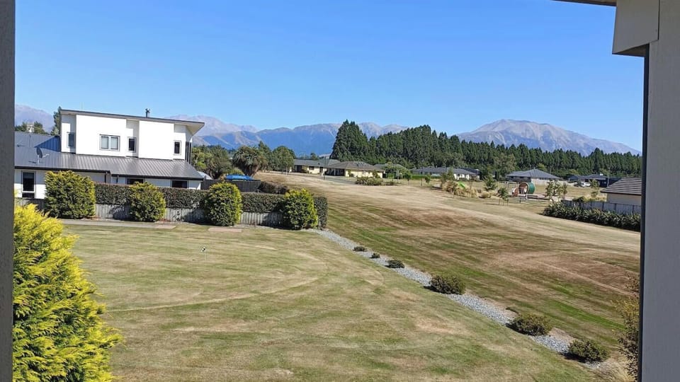 View from the balcony, resort golf putting in the foreground, public playground then Mt Hutt in the distance.