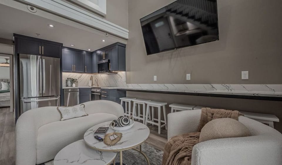 Full kitchen with plenty of storage, 6 bar stools for eating under the TV