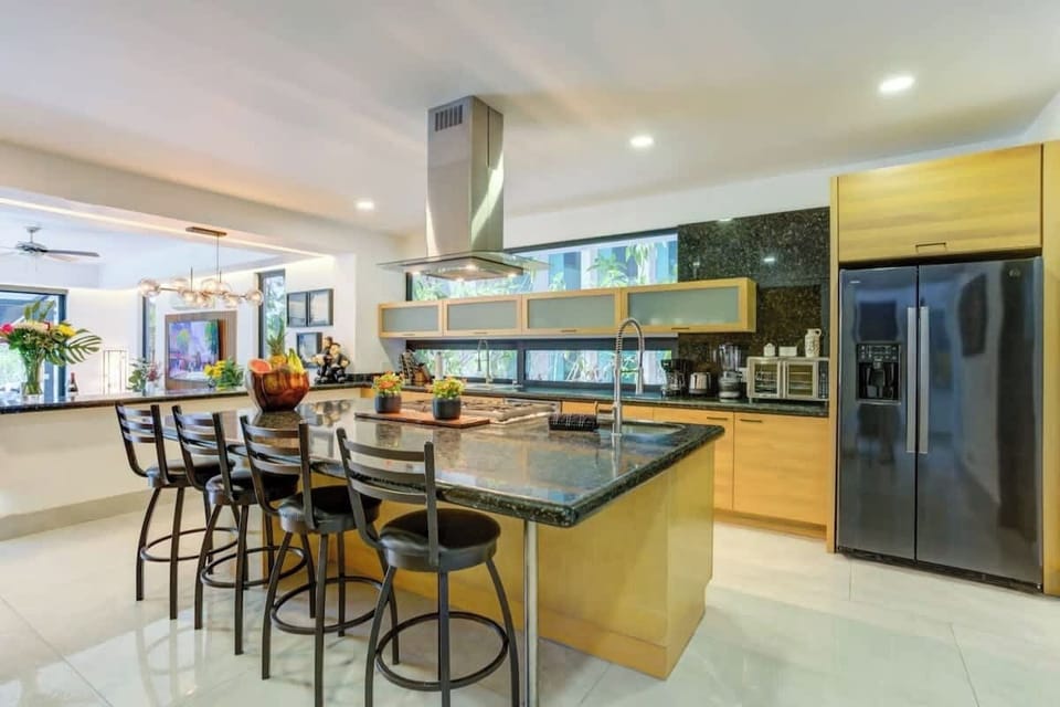 A phenomenal chef’s kitchen with granite countertops