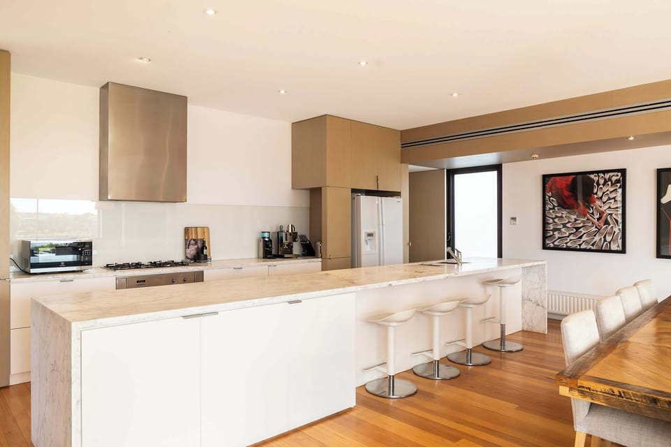 The huge marble island bench provides a generous space for holiday feasts or casual breakfasts