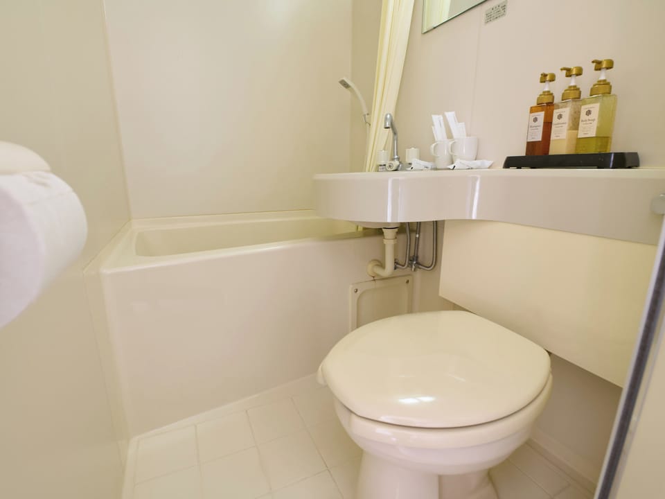 Twin Room with Shower and Toilet, Shared Bath [Non-smoking] | Bathroom | Slippers, towels, shampoo, toilet paper