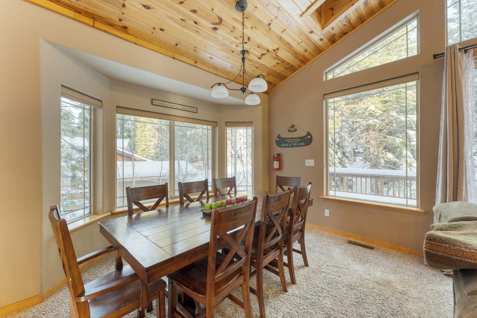 Dining area surrounded by windows.