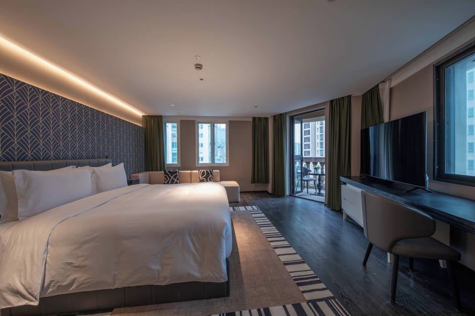 Premium bedding, down comforters, memory foam beds, free minibar
