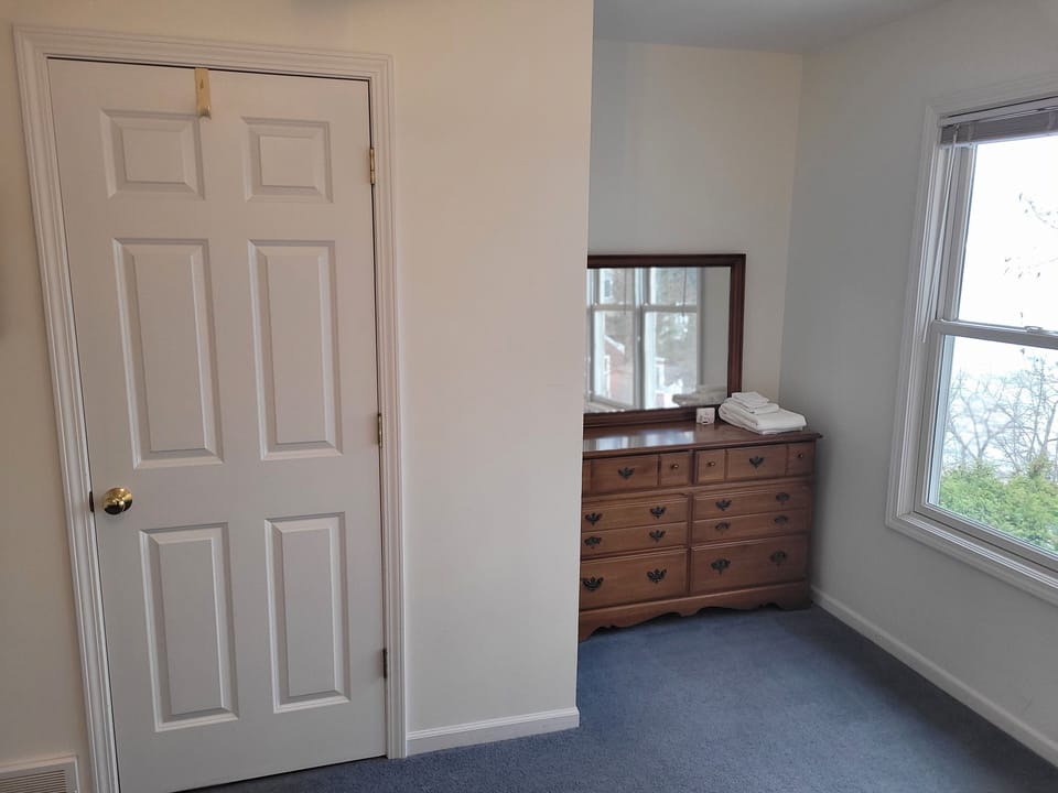 BEDROOM #2 (UPPER LEVEL):  Features a queen-size bed, great views of Lake Michigan, dresser, mirror, closet, desk, and private en suite full bathroom!