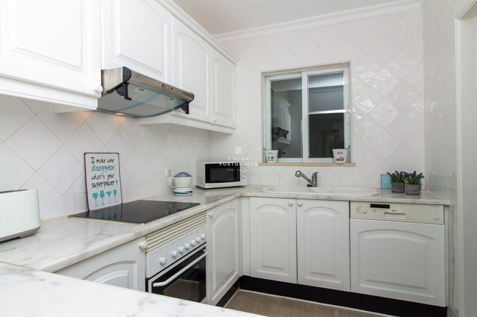 Microwave, dishwasher, coffee/tea maker, cookware/dishes/utensils