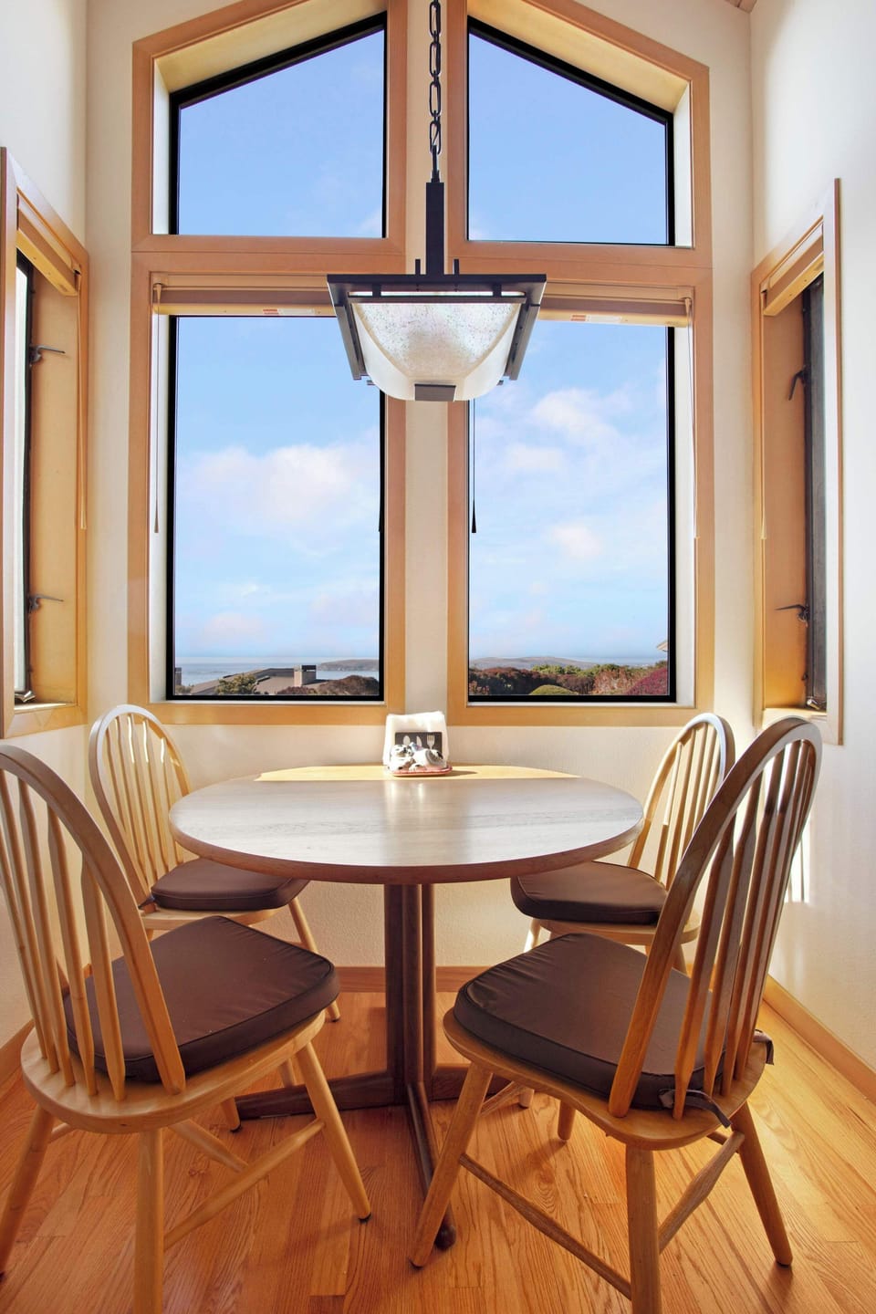 The breakfast nook offers the perfect spot to enjoy your morning coffee with ocean views.