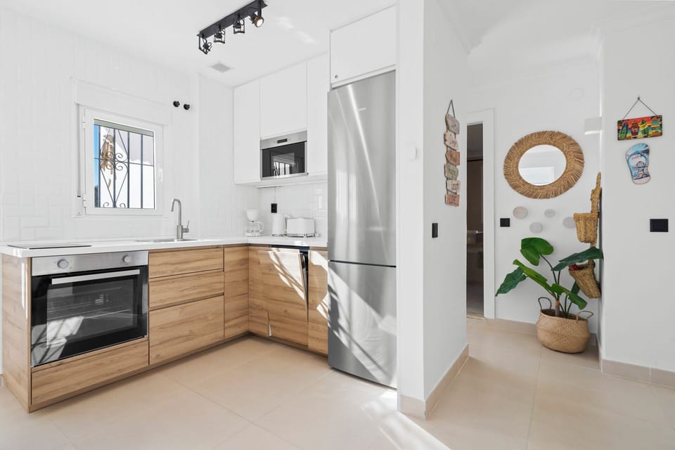 Fully equipped kitchen with a view - cook like a pro, wine in hand.