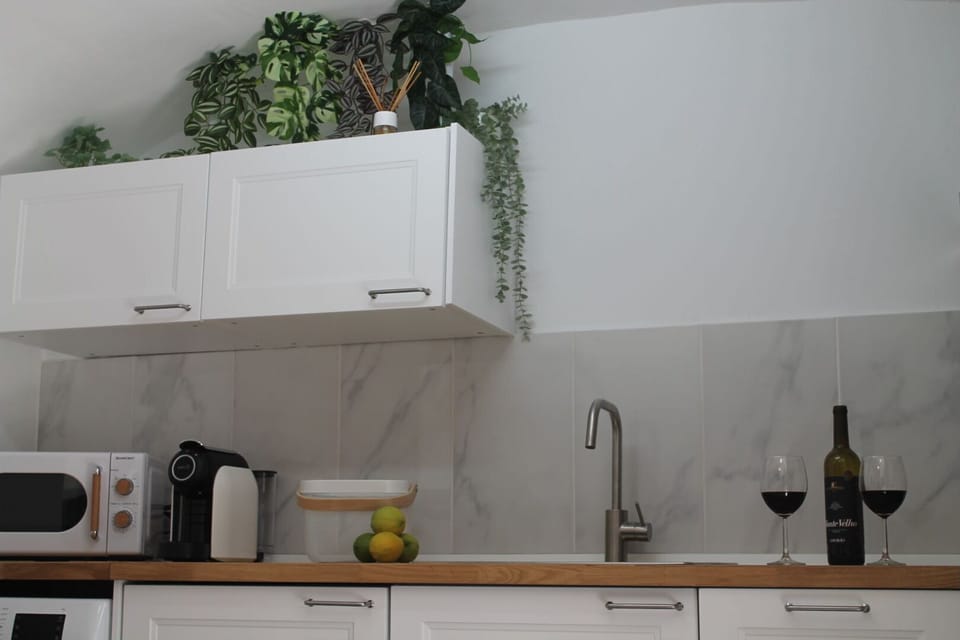 Cook up your favorites in our fully equipped kitchen with modern amenities, including a washing machine.