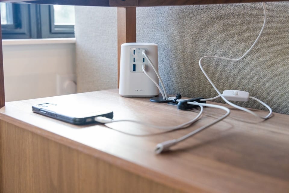 Provided charging station in the console table. USB-C and lightning cords are included. Additional open ports can be used with guest cords. Each bedroom includes a single USB charging brick. 