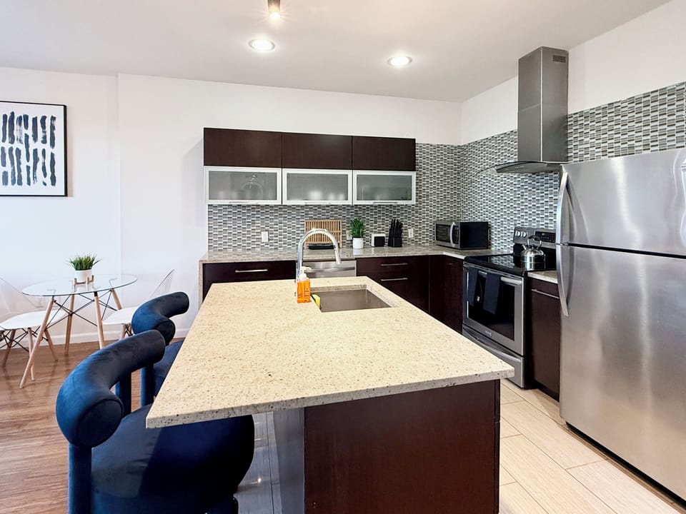  Open-concept kitchen,  fully-stocked with all your necessary kitchen needs 