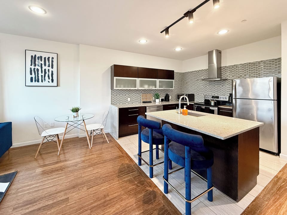  Open-concept kitchen,  fully-stocked with all your necessary kitchen needs 