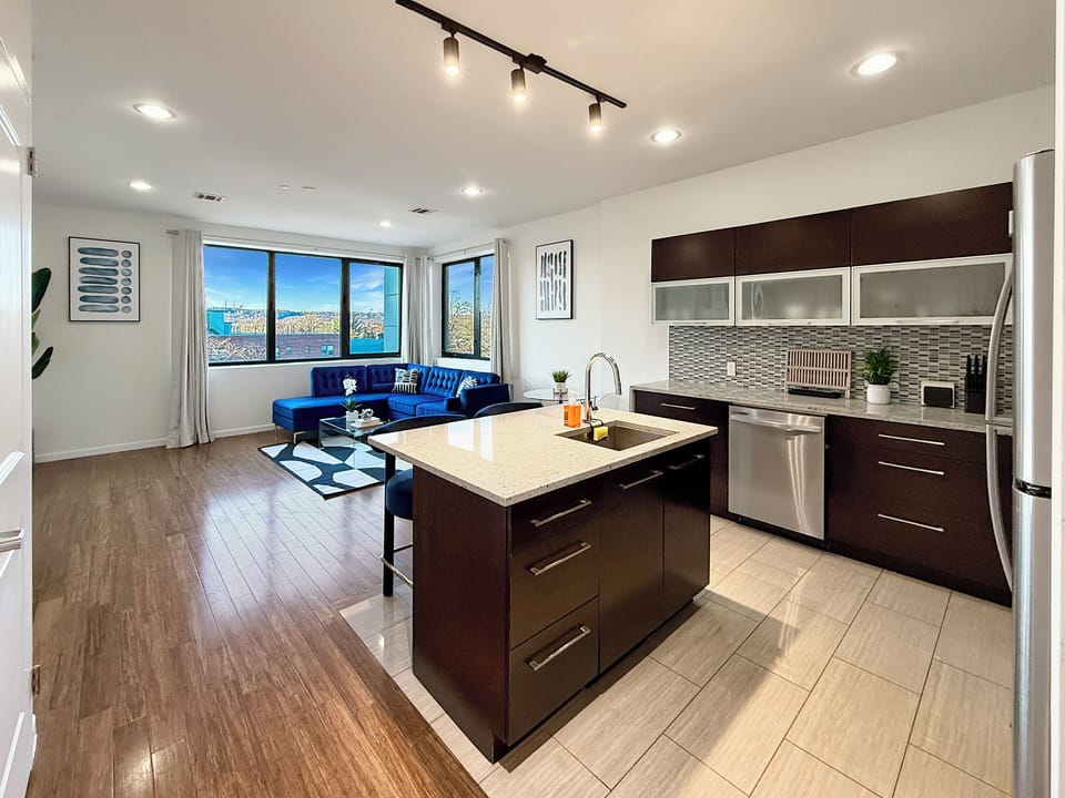  Open-concept kitchen,  fully-stocked with all your necessary kitchen needs 