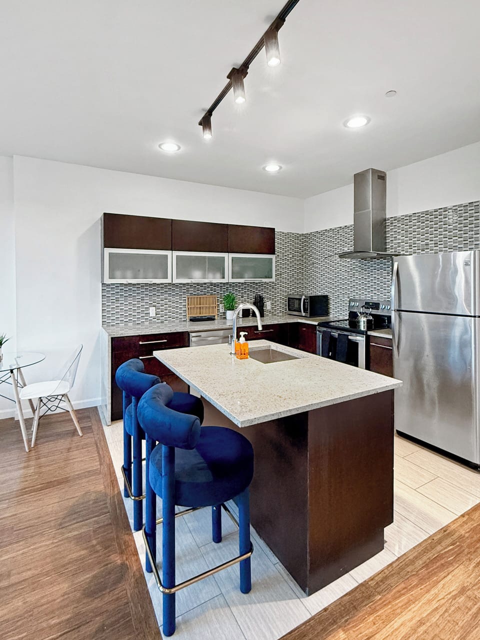  Open-concept kitchen,  fully-stocked with all your necessary kitchen needs 
