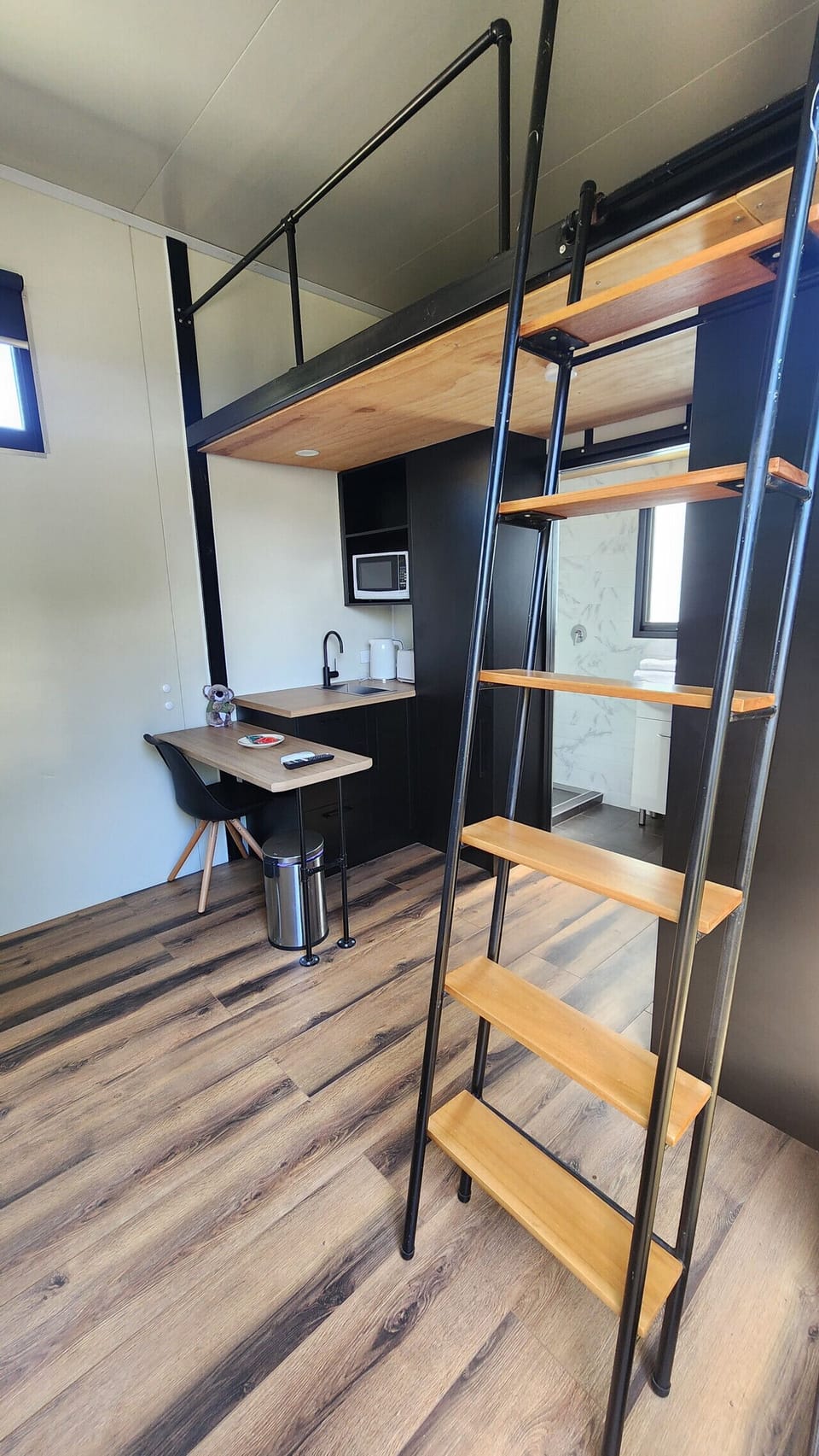 Well-equipped kitchenette with essentials and fresh towels for your convenience.