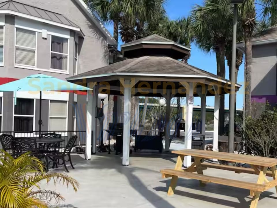 Outdoor charcoal grill with cozy picnic tables