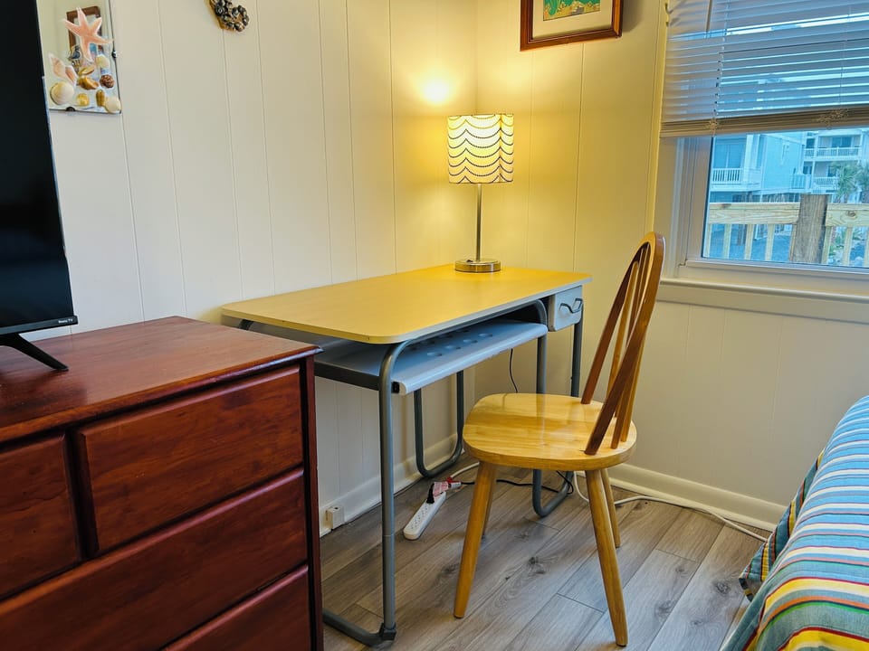 The Twin Room  has a comfortable desk for work away from the main living area. 
