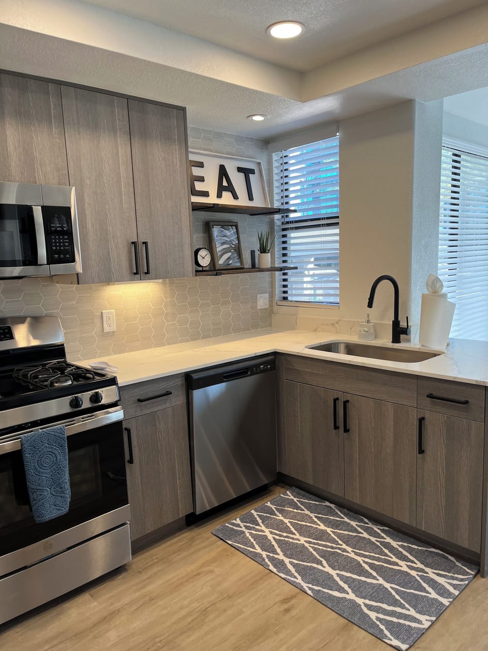 Completely updated kitchen with quartz counters, ss appliances, fully stocked