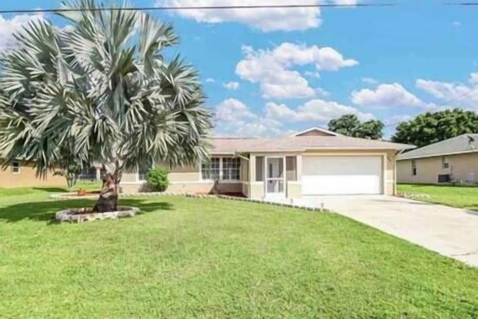 Front of house. Large yard. Large garage 