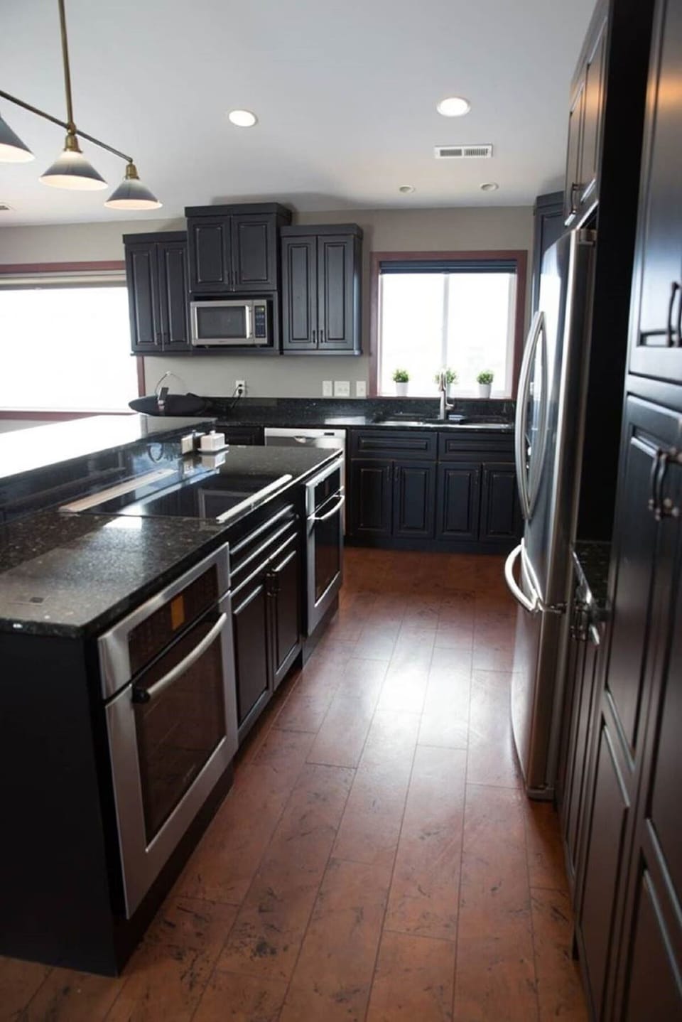 Double ovens, dishwasher and large refrigerator.