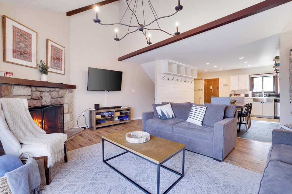 Living Room: Enjoy stylish charm with stunning decor and a warm fireplace, perfect for gatherings!