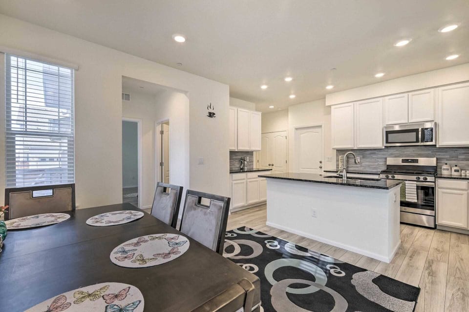 Sleek and spacious kitchen with modern appliances and a dining area for shared meals. Ideal for family gatherings or cozy dinners.