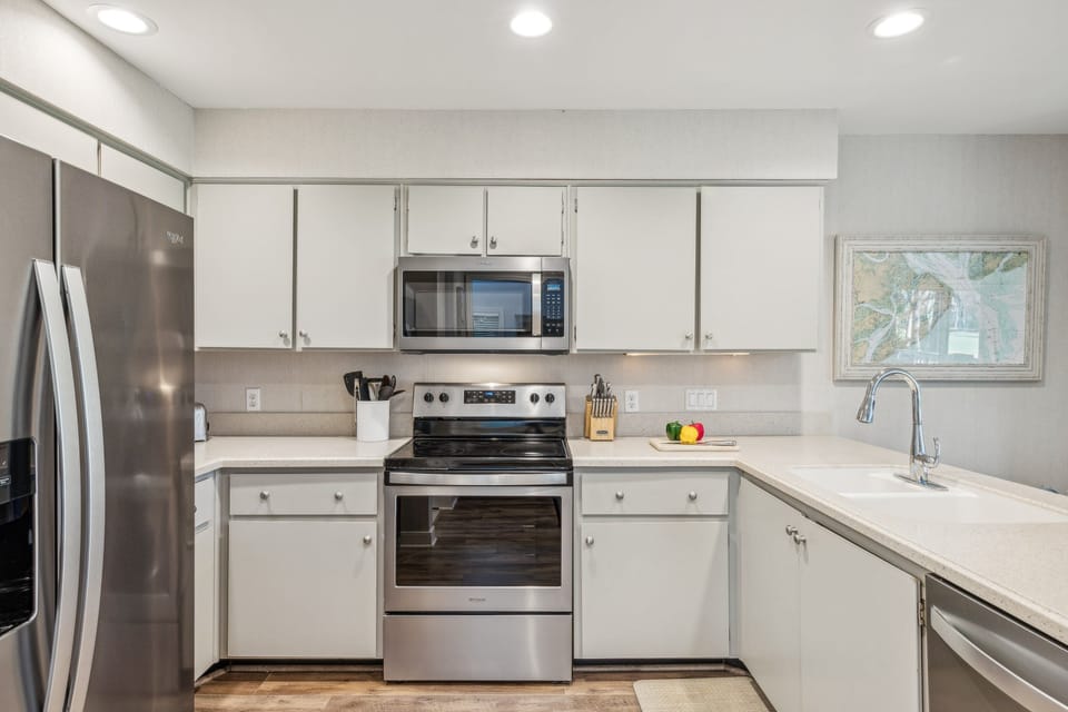 Stainless steel appliances and Keurig coffee maker.