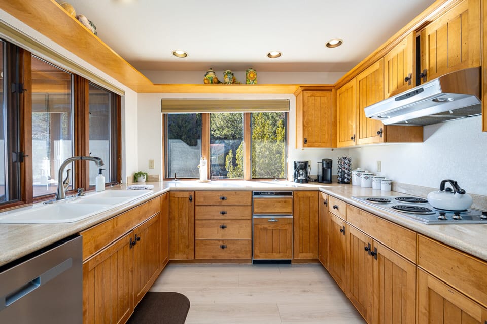 The kitchen is fully stocked for all your culinary needs with top-of-the-line appliances, utensils, and plenty of counter space to prepare anything from brunch to late-night snacks.