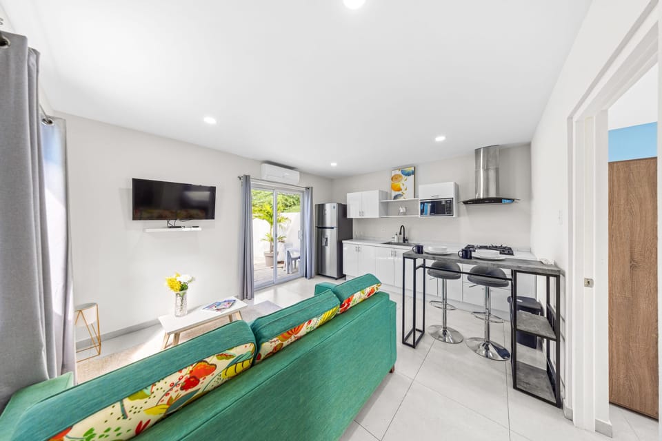 Open-plan living area with a modern kitchen, offering a seamless flow between spaces.