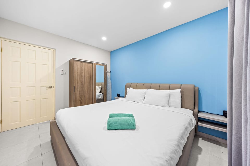 A spacious bedroom, bathed in soft light and cabinet.