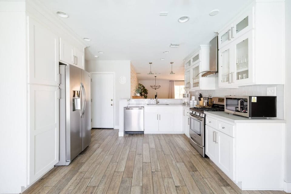 This open kitchen is fully equipped with anything you would need to cook any meal you desire!