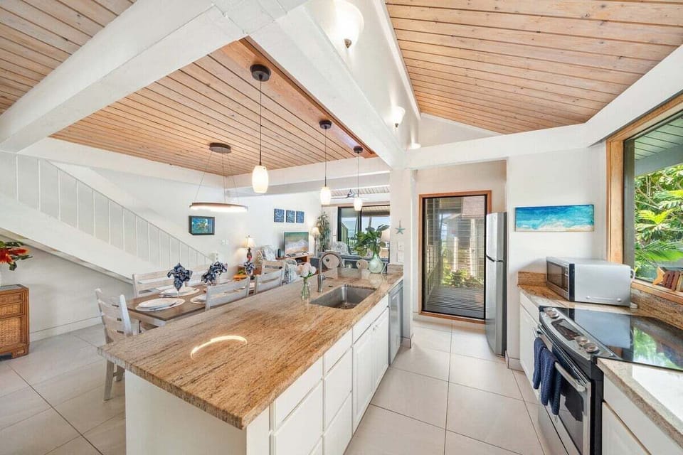 Spacious kitchen with plenty of counter space and a seamless flow into the dining area